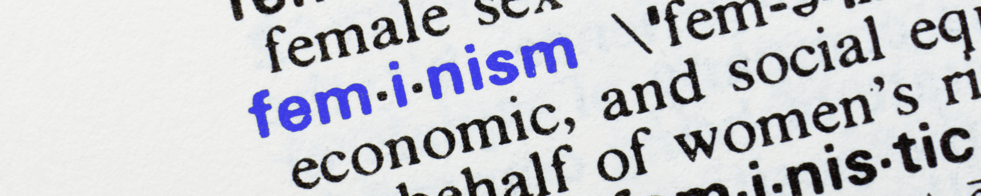 up close of dictionary page with word feminism highlighted